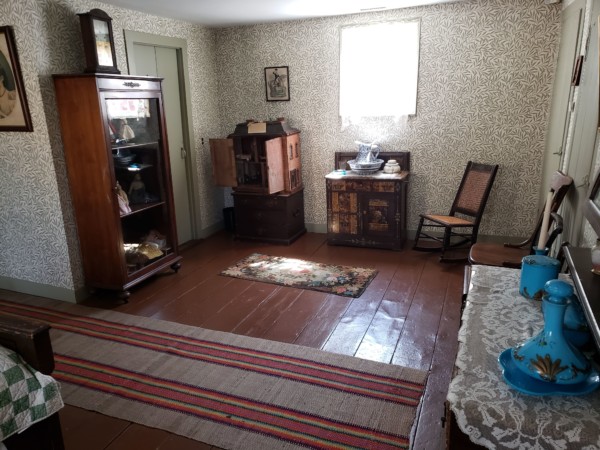 This room at the Wilton Historical Society is a reproduction of 1890's bedroom, complete with replica William Morris wallpaper. As it is today, activists would have dressed in their bedrooms before participating in protests and parades.